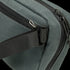 Close-up of the Condor Tech Pouch in dark green fabric, perfect for EDC or the range, featuring a black zipper, black strap, and silver hardware on one corner.